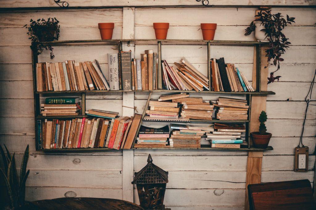 Survival Bookshelf Essentials Must-Have Reads for Preppers, a bookshelf full of books